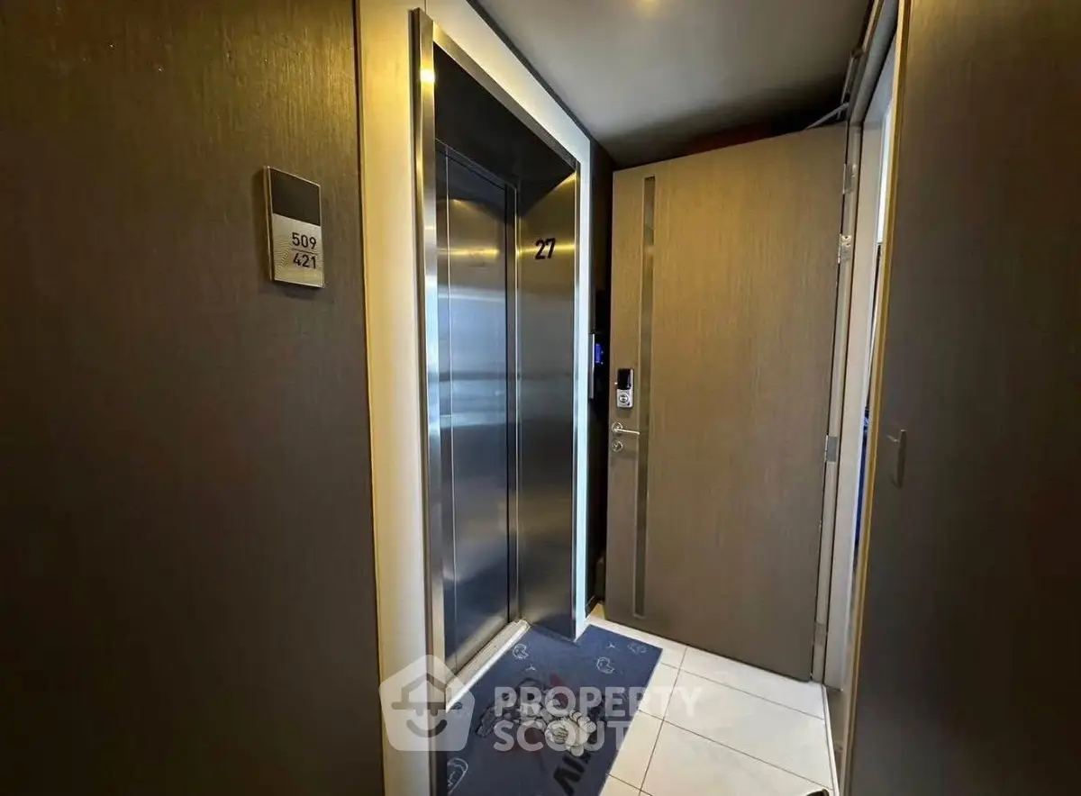 Modern elevator lobby with sleek design and room number signage