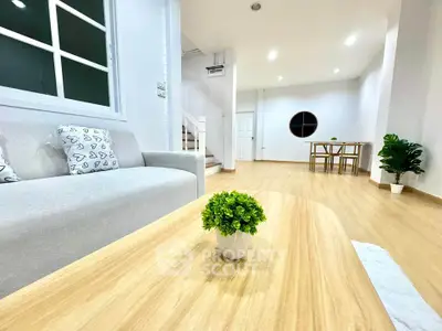 Modern living room with stylish decor and wooden flooring
