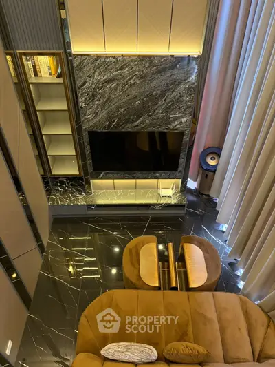 Luxurious modern living room with marble accents and elegant lighting