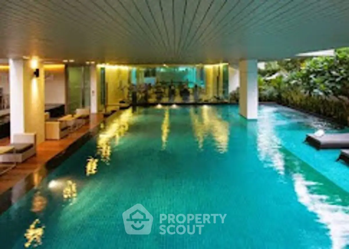 Luxurious indoor pool with modern design and ambient lighting