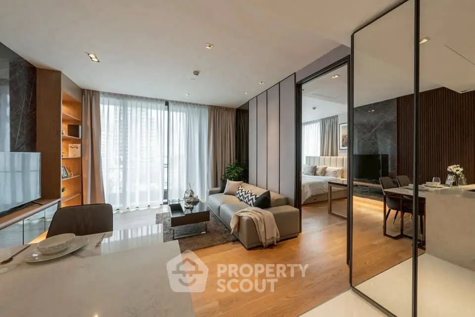 Luxurious modern living room with open layout and elegant decor in high-rise apartment.