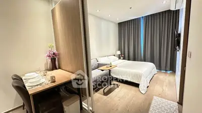 Modern bedroom with cozy dining area and stylish decor