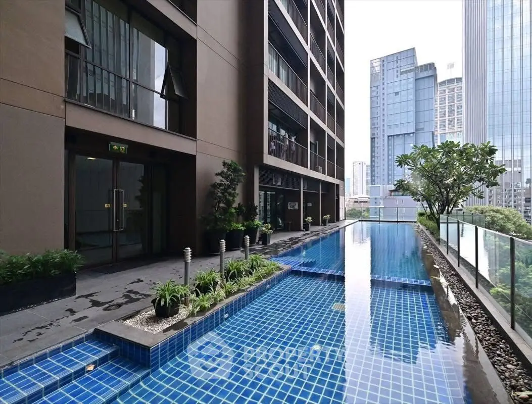 Luxurious high-rise building with stunning rooftop pool and city view
