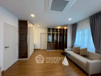Spacious modern living room with elegant furnishings and ample natural light