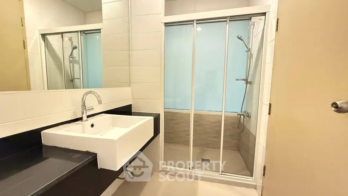 Modern bathroom with sleek shower and stylish sink design