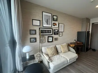 Modern living room with stylish decor and cozy seating in a contemporary apartment.