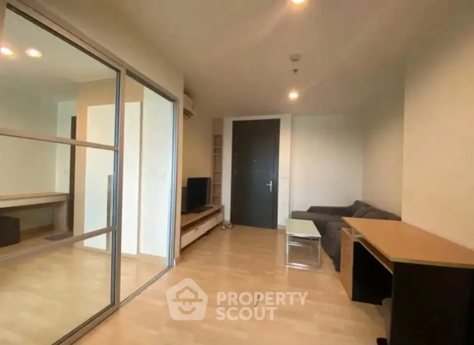 Spacious modern living room with sleek design and ample natural light.