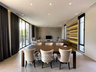 Spacious modern living room with elegant dining area and large windows