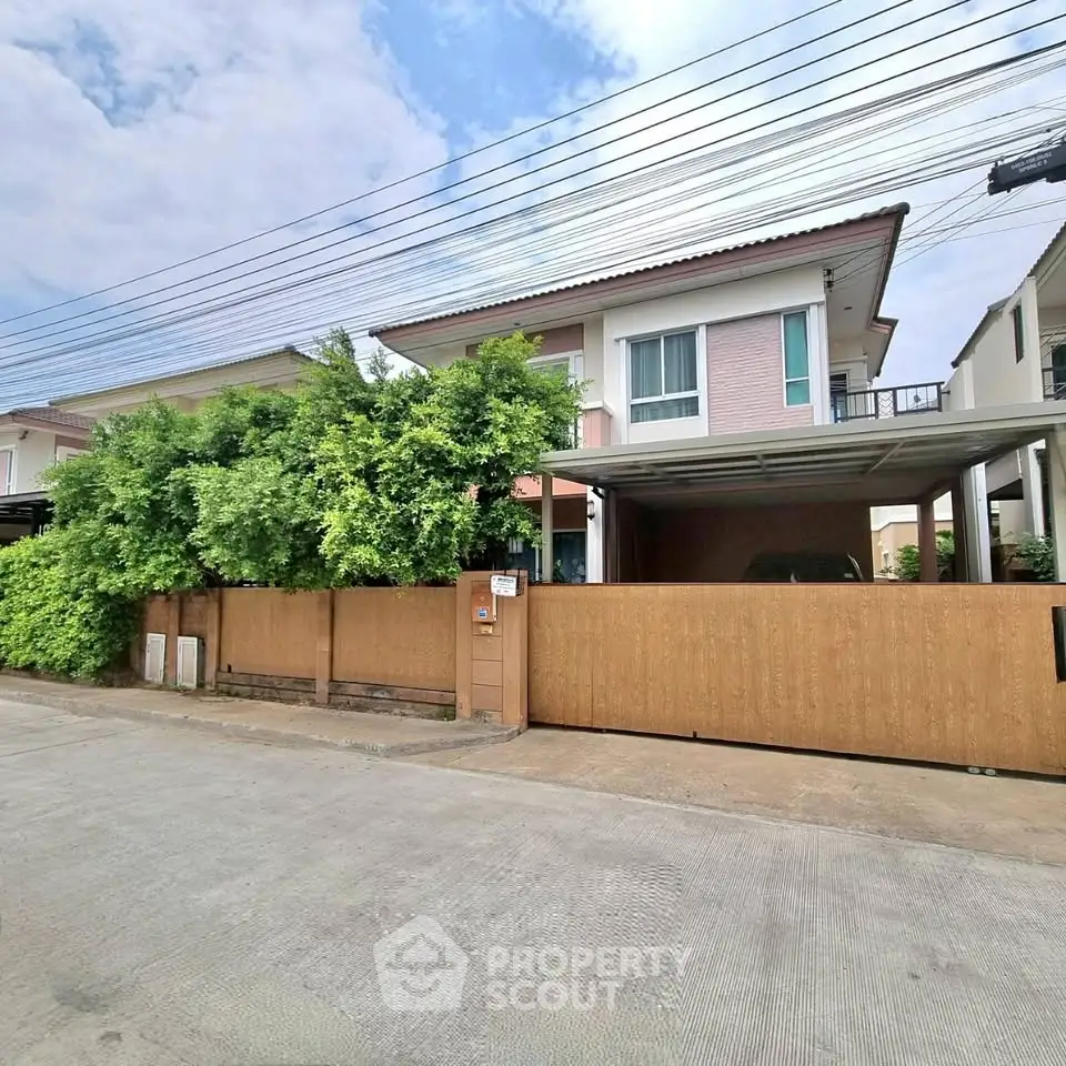 Charming suburban house with lush greenery and modern design, perfect for family living.