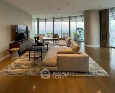 Luxurious living room with panoramic city views and modern furnishings