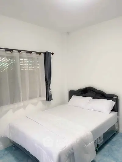 Cozy bedroom with white bedding and natural light