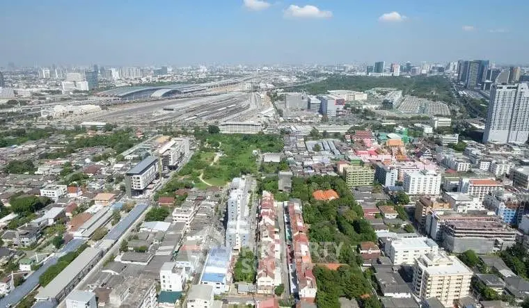 Stunning aerial view of urban landscape with diverse architecture and expansive cityscape.