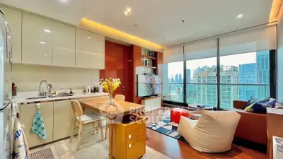 Modern open-layout kitchen and living room with city view