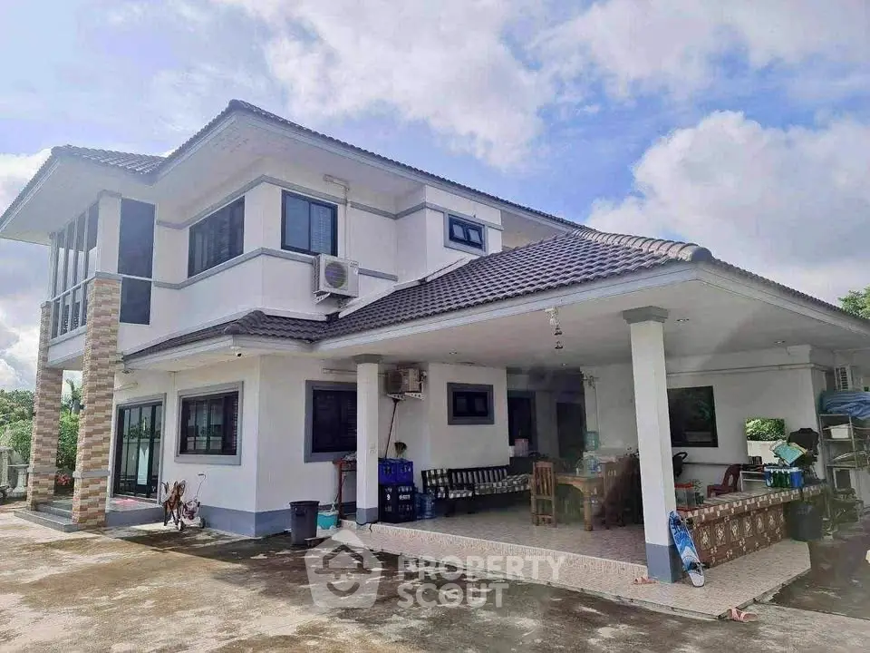 Spacious two-story house with covered patio and modern design