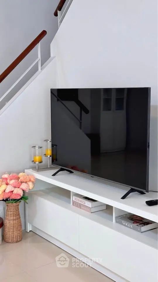 Modern living room with sleek TV setup and stylish decor