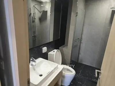 Modern bathroom with sleek design and glass shower enclosure