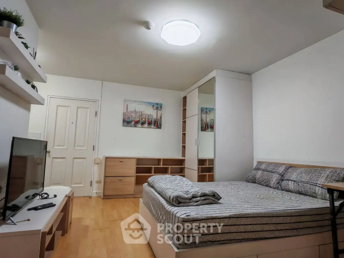 Modern bedroom with stylish decor and ample storage space