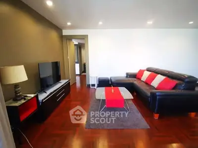Spacious living room with modern decor and hardwood floors
