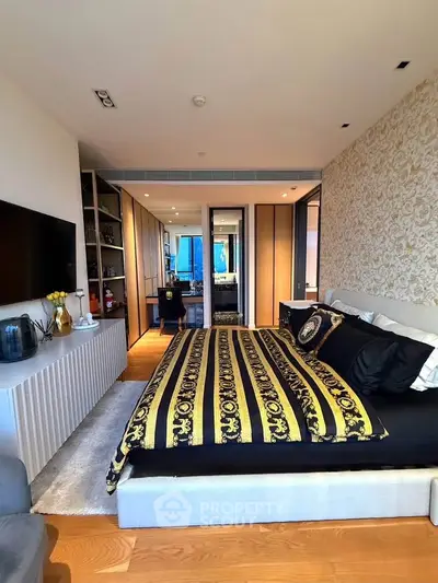 Luxurious bedroom with elegant decor and modern amenities in a stylish apartment.