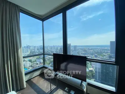 Stunning corner unit with panoramic city views and modern interior design.