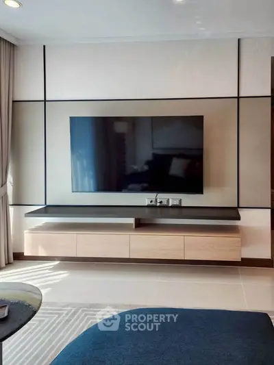Modern living room with sleek TV setup and stylish furniture