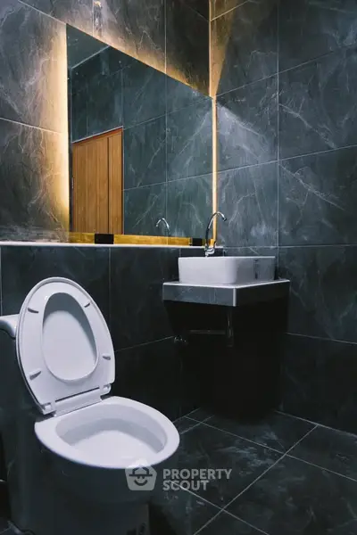 Modern bathroom with sleek design and elegant lighting