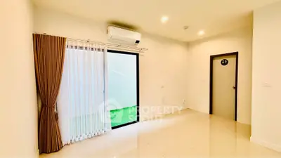 Spacious living room with sliding glass door and air conditioning, ideal for modern living.