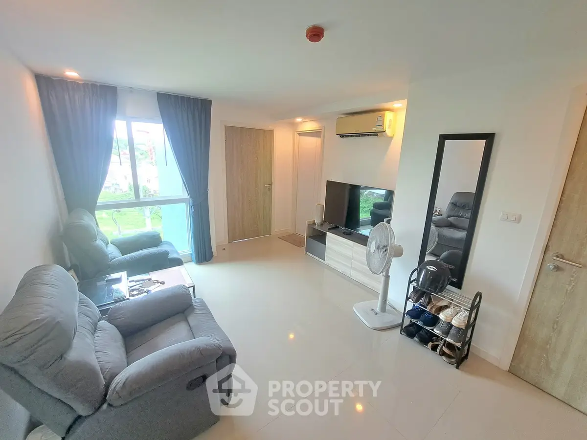 Modern living room with cozy seating and natural light