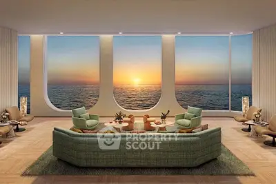 Luxurious living room with panoramic ocean view and elegant furnishings at sunset.