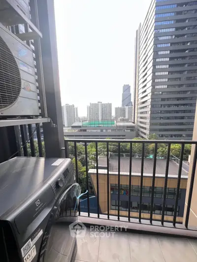 Modern balcony with city view and washing machine, perfect for urban living.