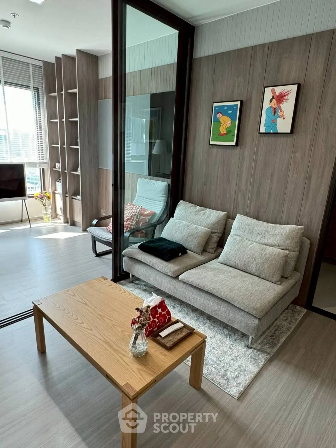 Modern living room with stylish decor and natural light in a contemporary apartment.