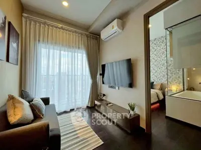 Modern living room with sleek design, featuring a cozy sofa, wall-mounted TV, and large window with curtains.