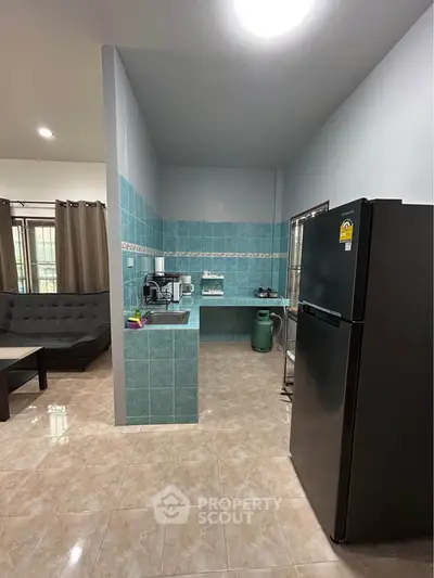 Spacious kitchen with modern appliances and open layout in a cozy home setting.