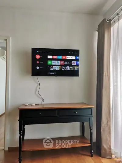 Modern living room with wall-mounted TV and elegant console table