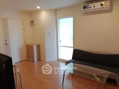 Modern living room with sleek furniture and air conditioning in a cozy apartment.