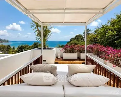 Luxurious balcony with stunning ocean view and elegant seating area