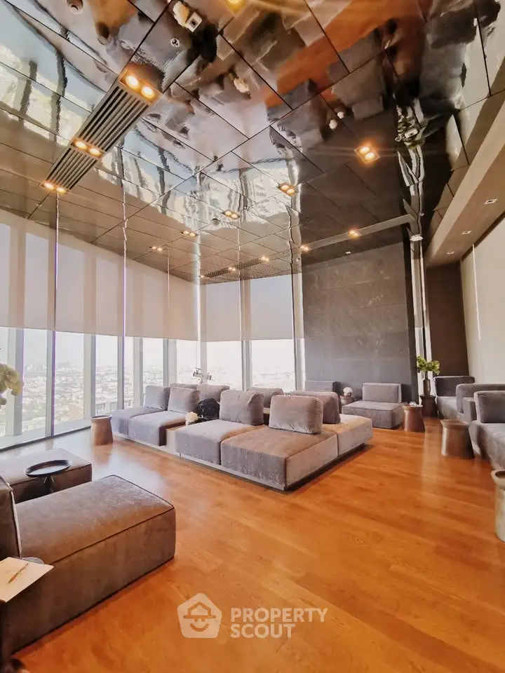 Luxurious modern living room with panoramic city views and elegant furnishings.