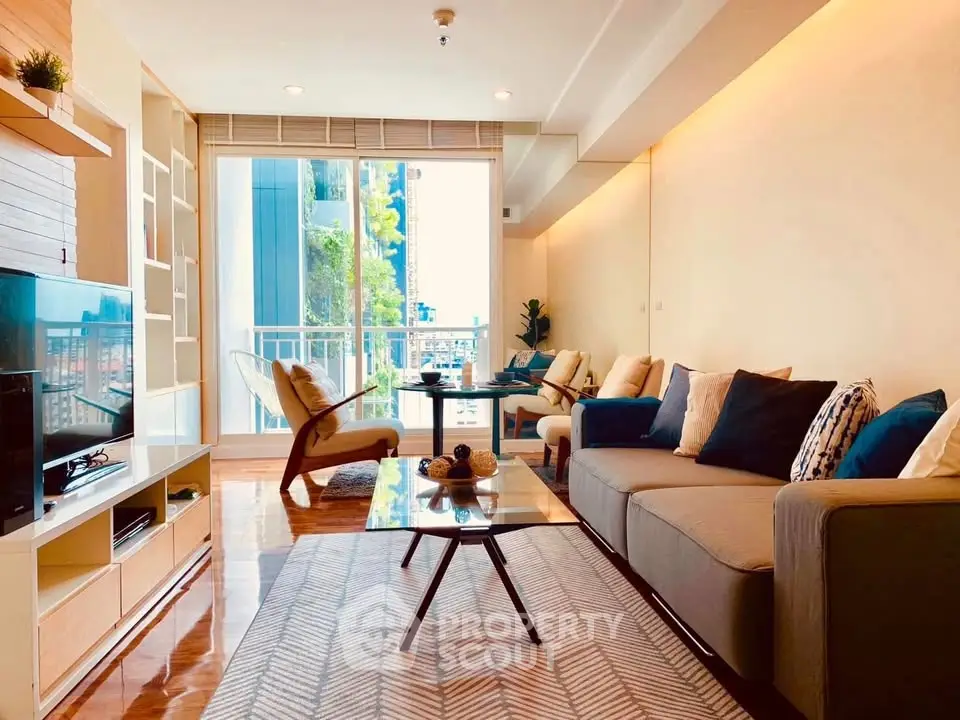 Spacious modern living room with stylish decor and balcony view