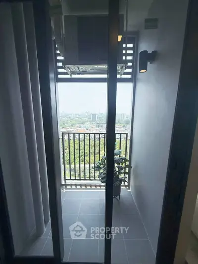 Charming balcony with stunning cityscape view, perfect for relaxation and enjoying the outdoors.