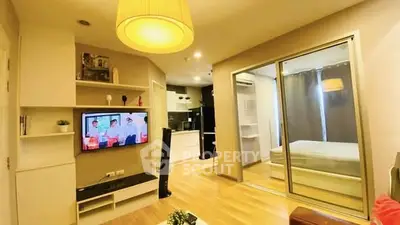 Modern living room with open layout and cozy bedroom view