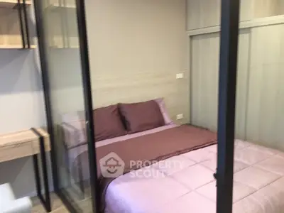 Cozy bedroom with glass partition and modern furnishings