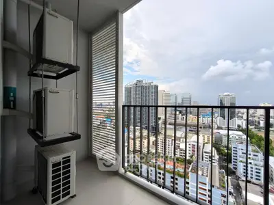 High-rise balcony with stunning cityscape view and modern architecture.