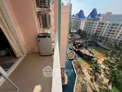 Stunning balcony view overlooking a unique pirate ship-themed landscape in a modern residential complex.