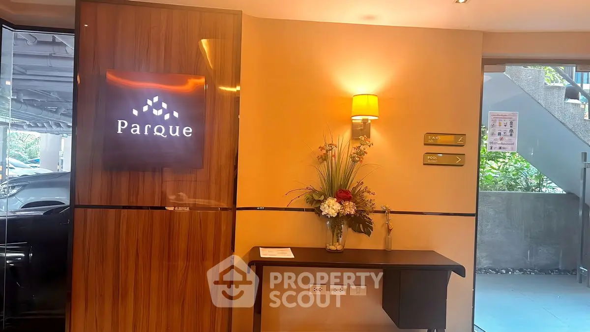 Elegant building entrance with stylish decor and ambient lighting