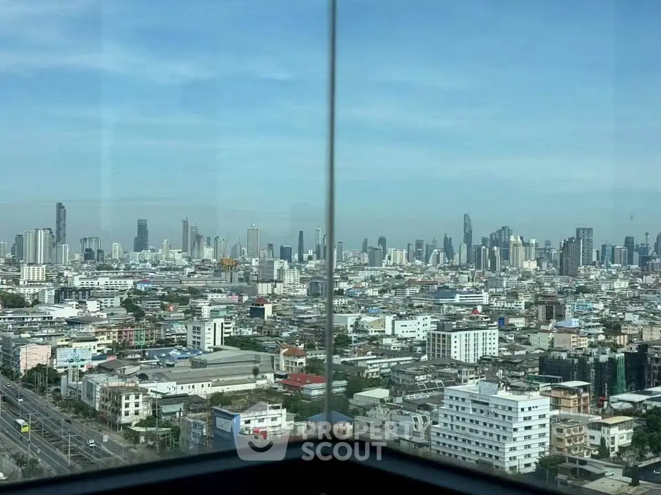 Stunning panoramic city view from a high-rise building corner unit, showcasing urban skyline.