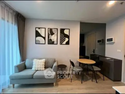 Modern living room with stylish decor and cozy seating area in a contemporary apartment.