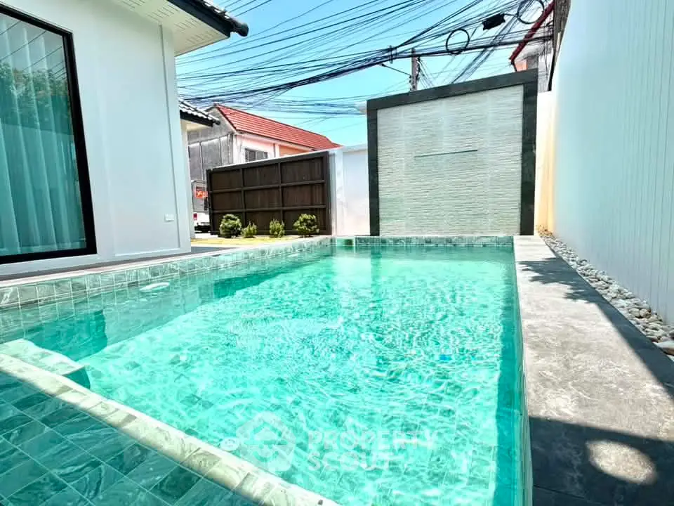 Luxurious private pool with modern design in a serene residential setting, perfect for relaxation and entertainment.