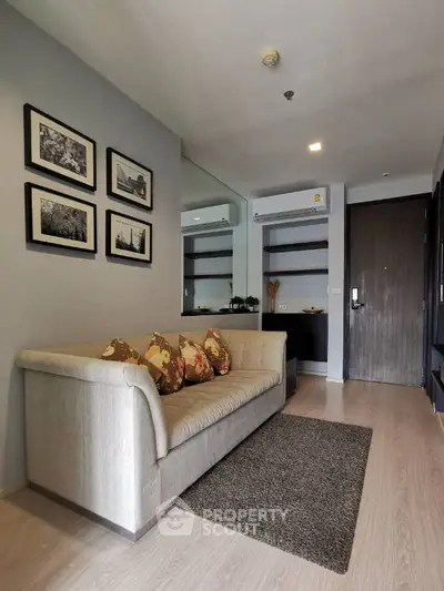 Modern living room with cozy sofa and stylish decor in a contemporary apartment.