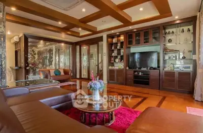 Luxurious living room with elegant decor and modern entertainment center