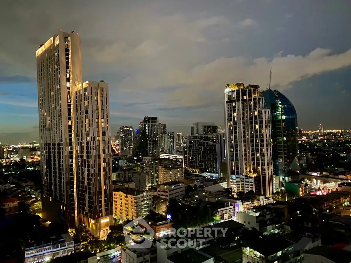 Stunning cityscape view with illuminated skyscrapers at dusk, showcasing urban living.